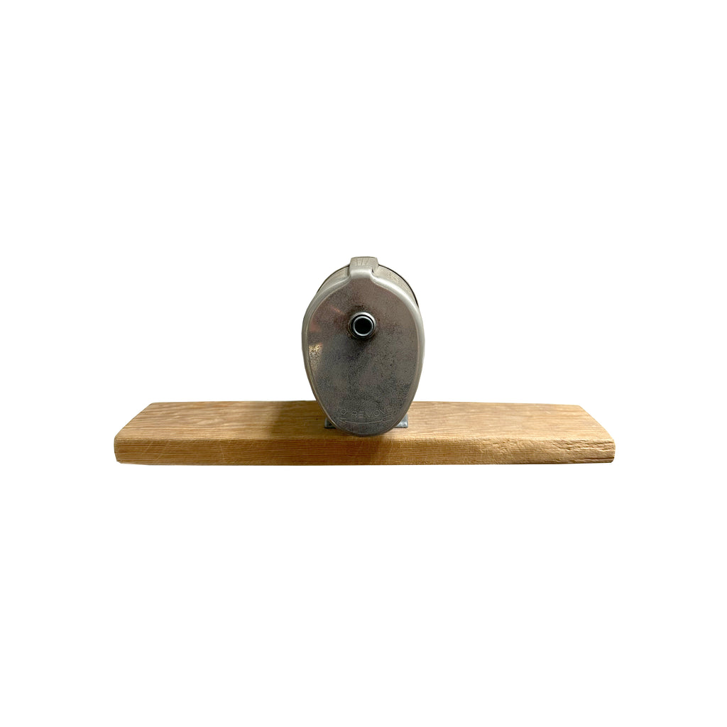 Antique Pencil Sharpener on Wood