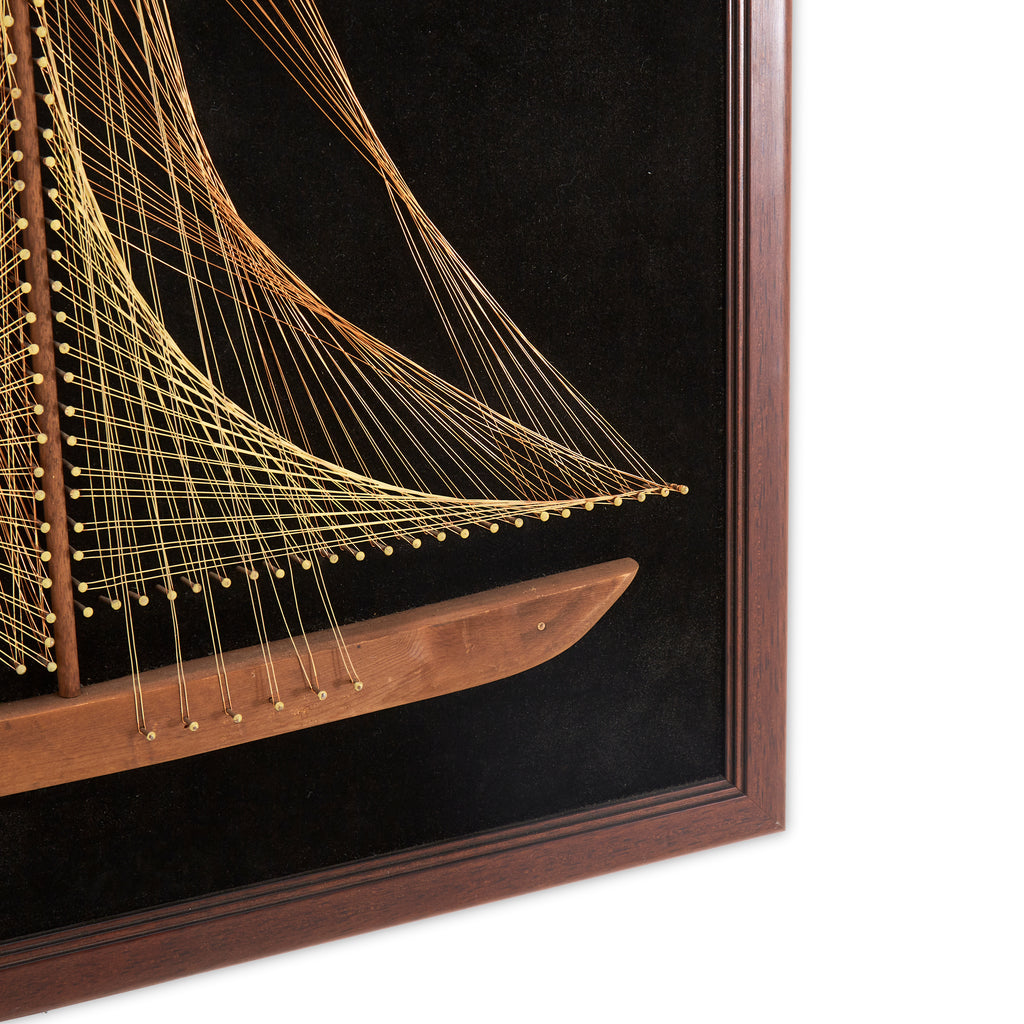 String Sailboat on Black Felt