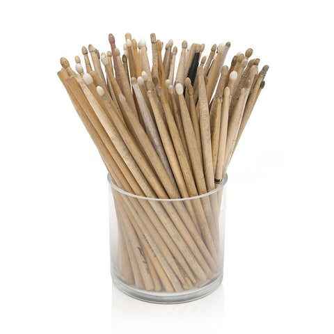 Brown Drumsticks In Glass Cylinder