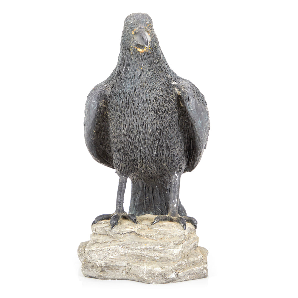 Crow Perched on Rock Sculpture