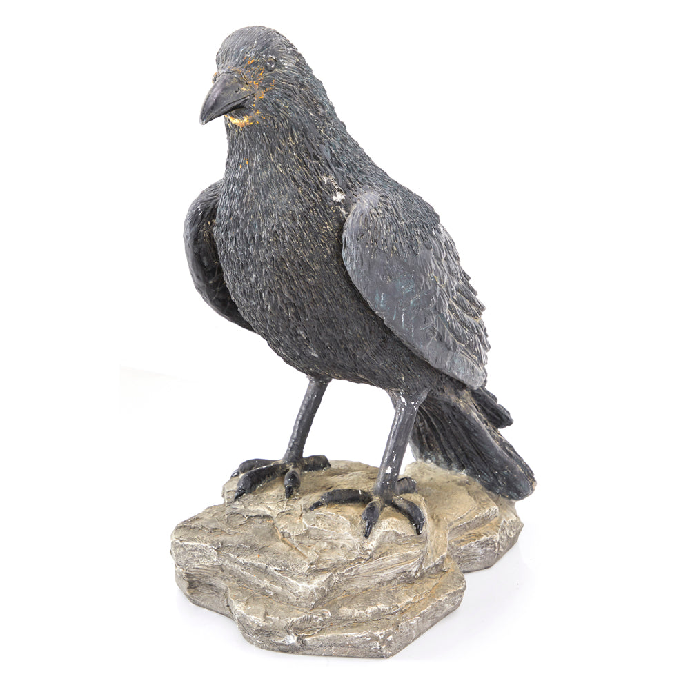 Crow Perched on Rock Sculpture