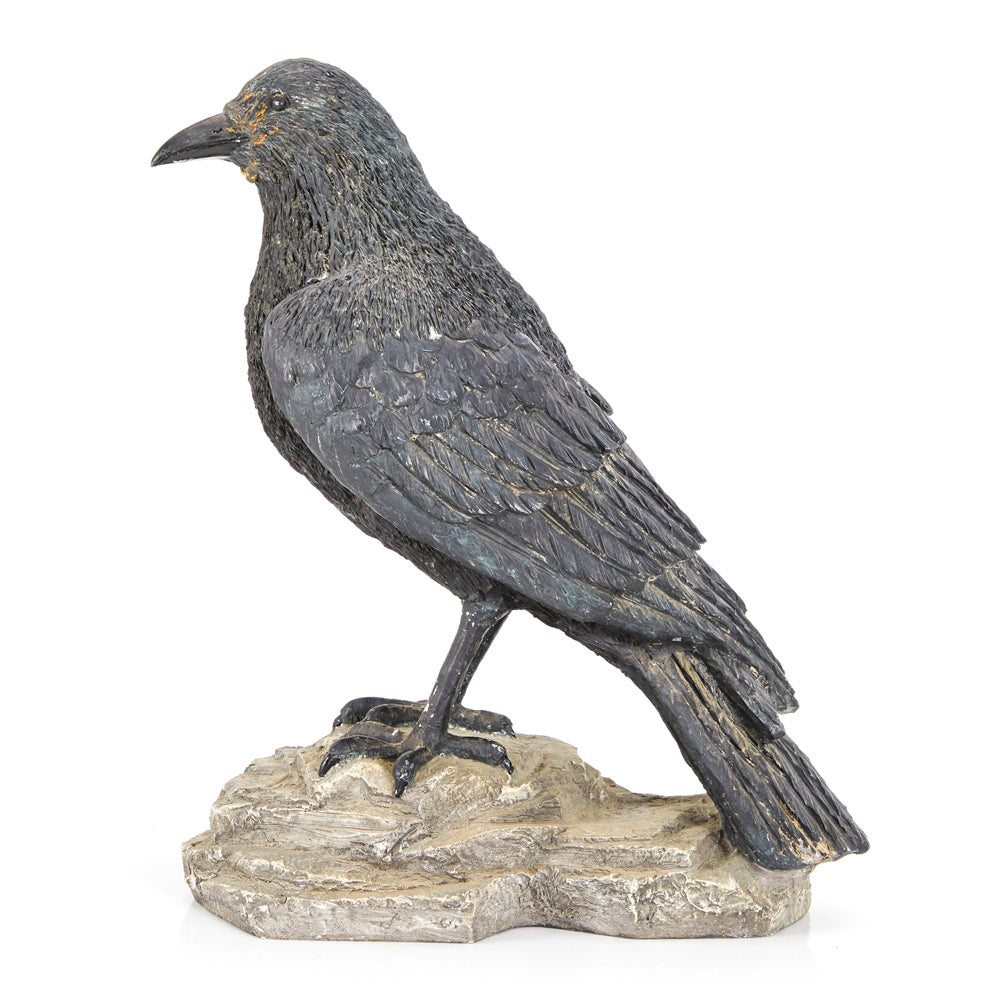 Crow Perched on Rock Sculpture