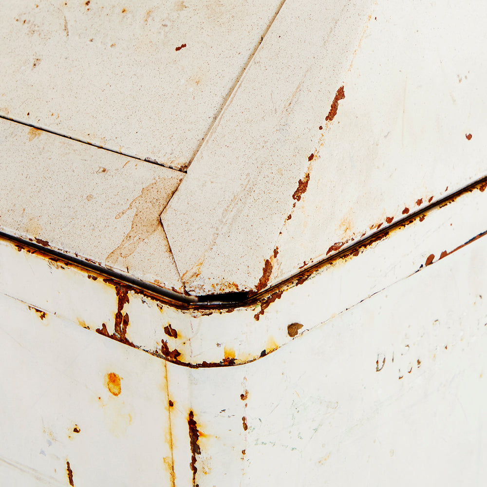 White Rusted Metal Garbage Can