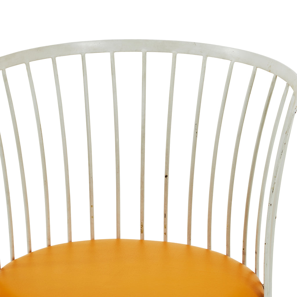 White Rod Chair with Orange Seat Cushion