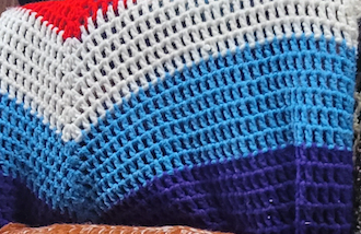 Red white and blue knitted throw